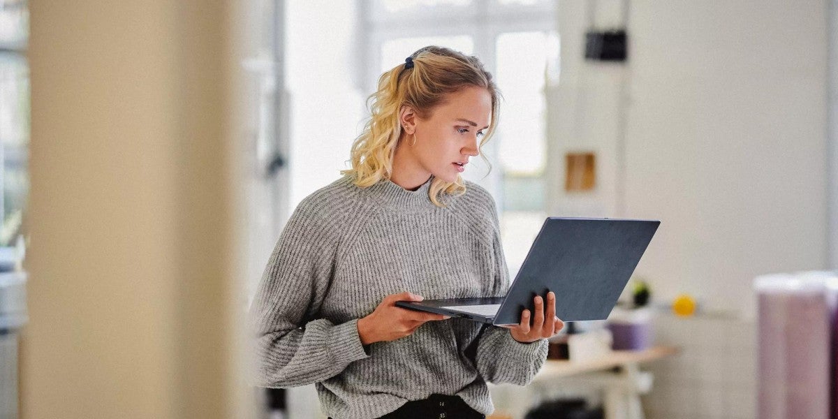 Woman working on her laptop.