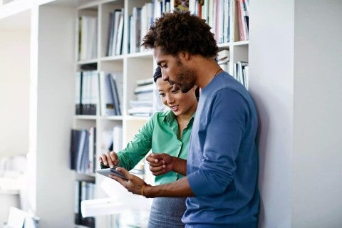 Photo of couple with tablet