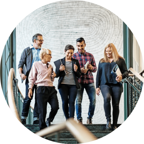 Group of people walking down stairs.