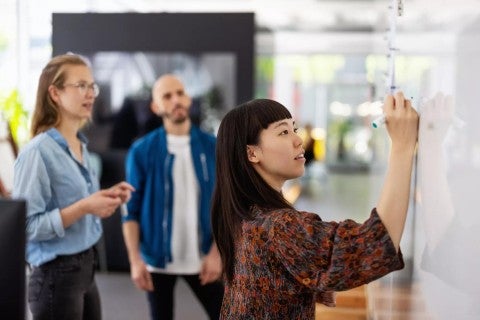 Woman using whiteboard