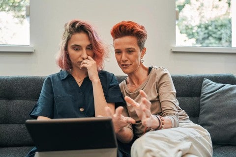 Two women looking at tablet