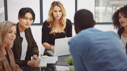 Employees discussing award winning strategies