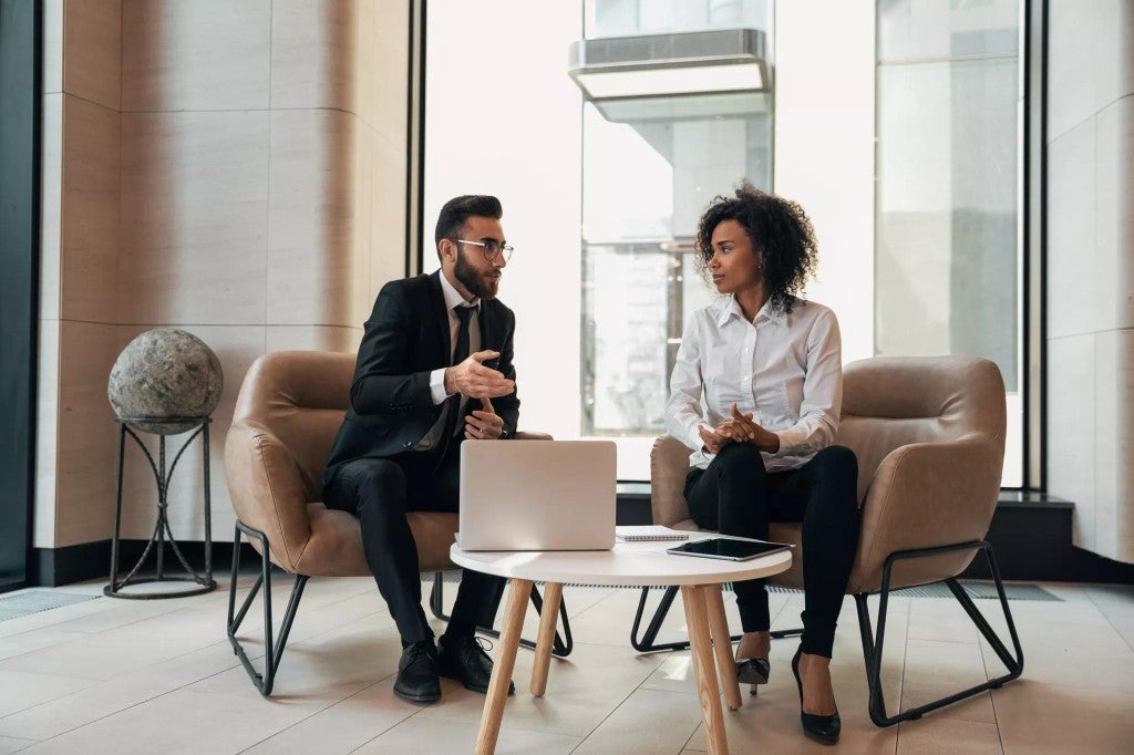 Man and woman meeting in an office setting.